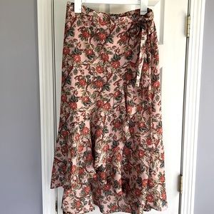 NWT high low wrap skirt. Brand new with tags. Small hole see photos. Womens